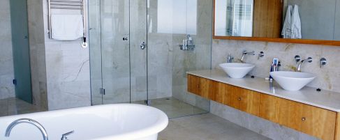 Beautiful modern bathroom with gleaming resurfaced clawfoot bath